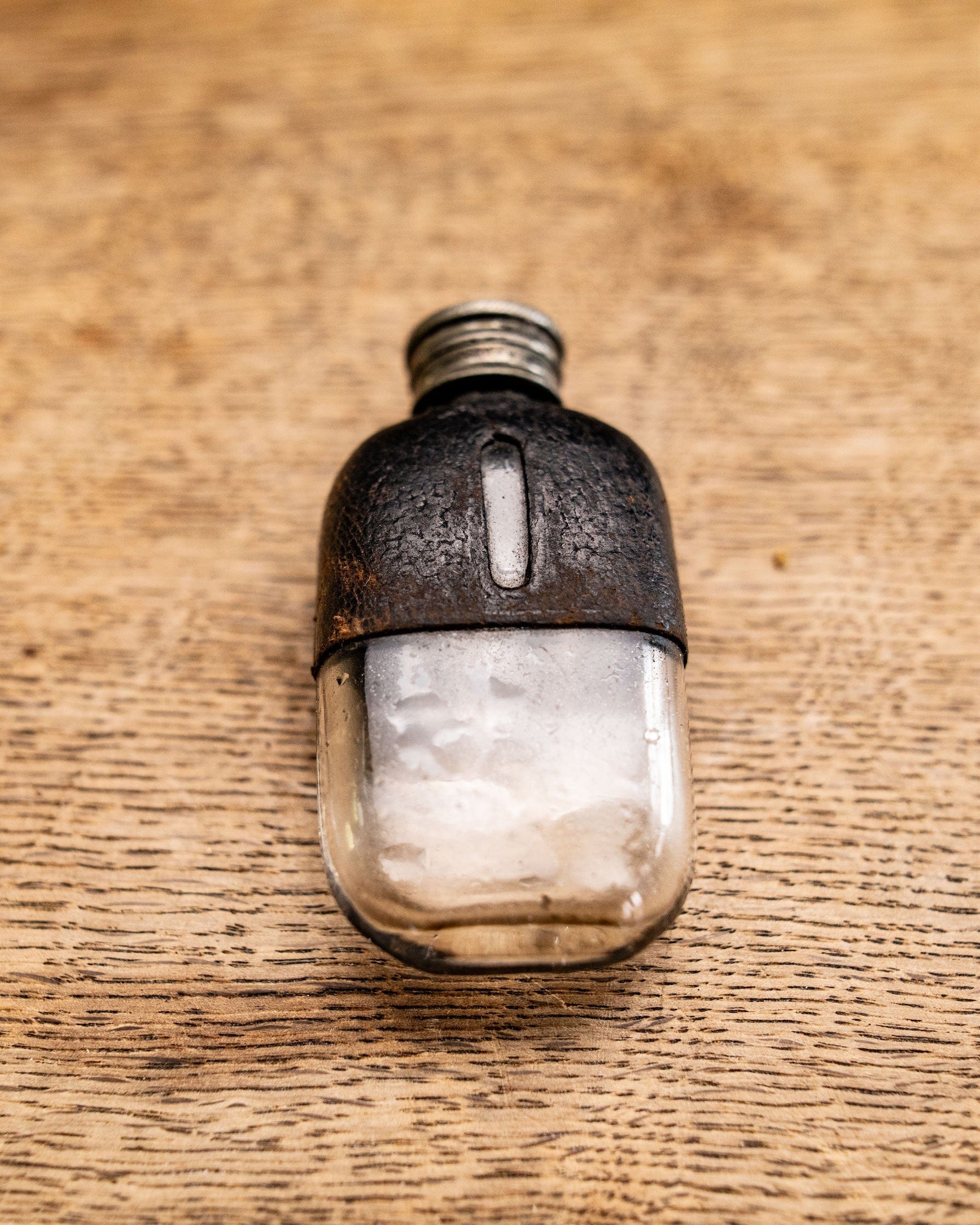 Pewter and glass leather flask