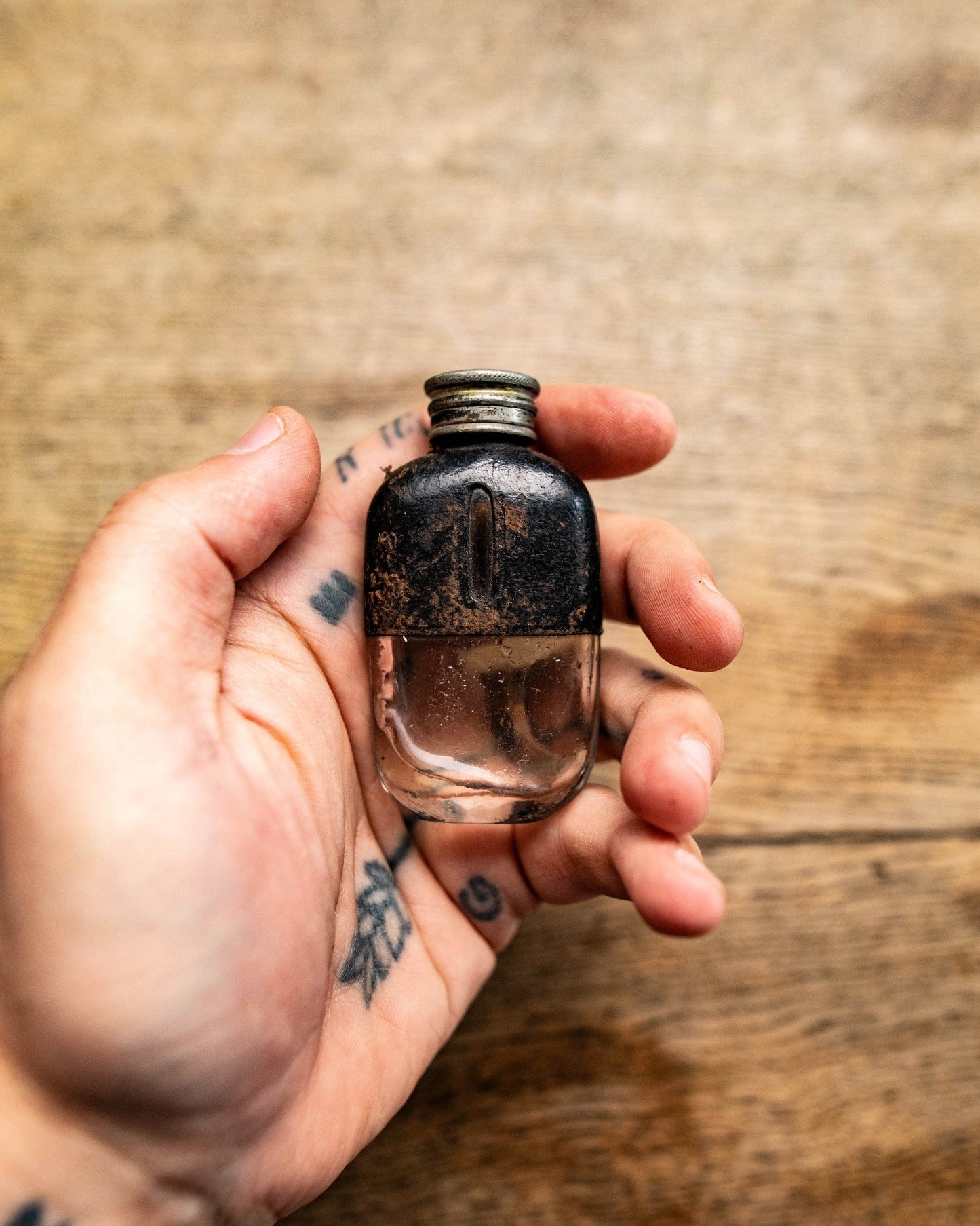 Pewter and glass leather flask